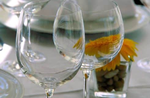 Close up view of empty wine glasses on a set dining table